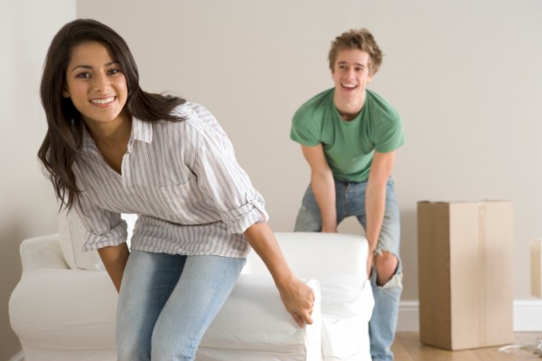 Young Couple Moving Into New Home